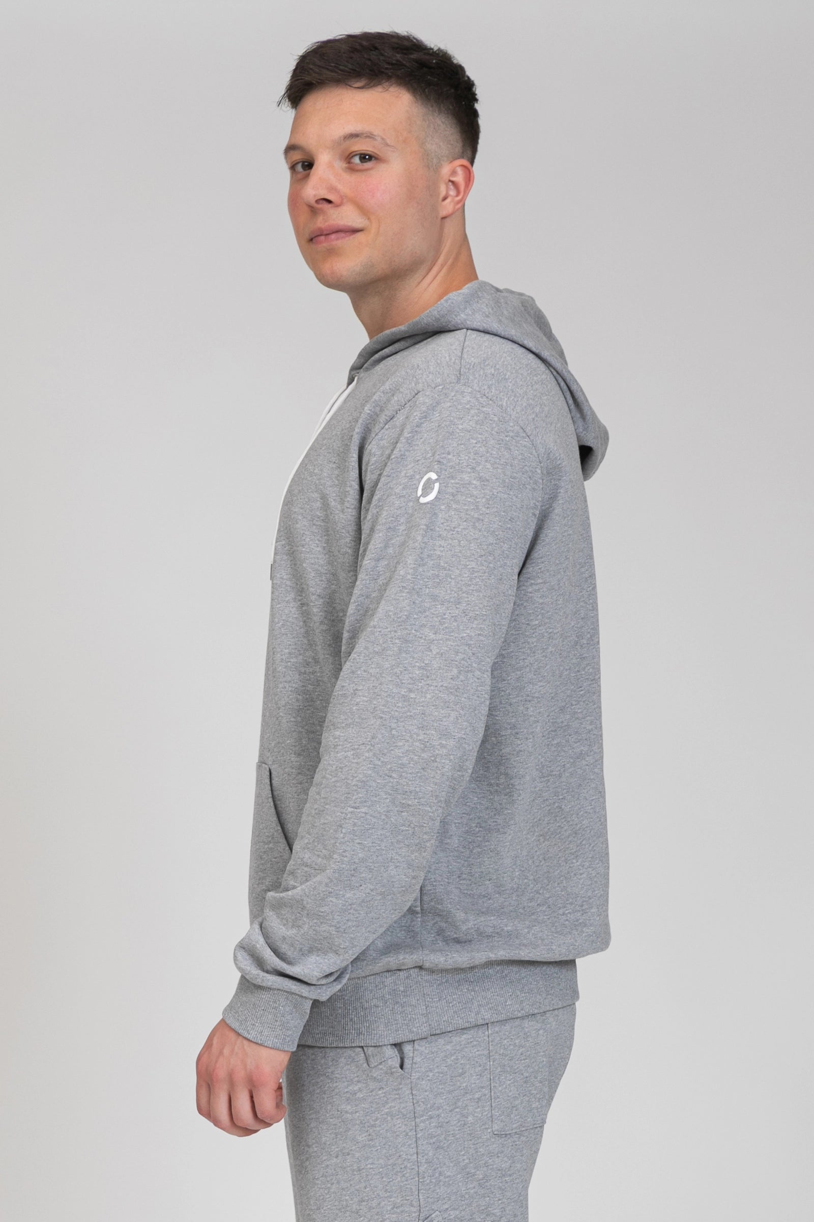 tuta sportiva in cotone oversize Felpa Over Con Cappuccio FW 24/25 Grigio Chiaro Melange Uomo - FGM04 - Linea Ikonic Uomo - fgm04