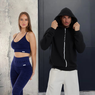 un ragazzo con felpa FGM04 e una ragazza con completo da allenamento FGM04